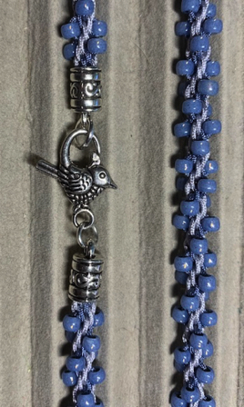 July 6 - Kumi blue bird necklace. July 6 - Kumi blue bird necklace.